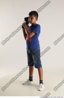 TIMBO STANDING POSE WITH GUN